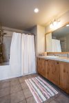 Lovely bathroom with tub/shower combo and tile floor